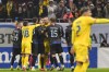 Kosovo's Amir Rrahmani, left, argues with Romania's Denis Alibec during the UEFA Nations League soccer match between Romania and Kosovo was suspended at the National Arena stadium in Bucharest, Romania, Saturday, Nov. 16, 2024. (AP Photo/Alexandru Dobre)