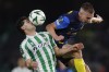 Betis' Johnny Cardoso, left, challenges for the ball with Celje's Mark Zabukovnik during a Conference League soccer match between Betis and Celje at the Benito Villamarin stadium in Seville, Spain, Thursday, Nov. 7, 2024. (AP Photo/Angel Fernandez)