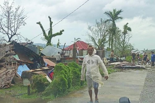 In this photo provided by the MDRRMO Viga Catanduanes, residents try to fix their damaged homes caused by Typhoon Man-yi in Viga, Catanduanes province, northeastern Philippines Sunday, Nov. 17, 2024. (MDRRMO Viga Catanduanes via AP)
