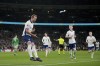 England's Harry Kane, left, celebrates after scoring the opening goal during the UEFA Nations League soccer match between England and the Republic of Ireland at Wembley stadium in London, Sunday, Nov. 17, 2024. (AP Photo/Kin Cheung)