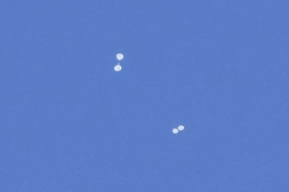 FILE - Balloons carrying what local media reported