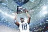 Toronto Argonauts' Dejon Brissett (18) lifts the Grey Cup after defeating the Winnipeg Blue Bombers in CFL football action at the 111th Grey Cup in Vancouver on Sunday, November 17, 2024. THE CANADIAN PRESS/Nathan Denette