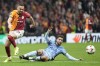 Galatasaray's Berkan Kutlu challenges for the ball Tottenham's Rodrigo Bentancur during the Europa League opening phase soccer match between Galatasaray and Tottenham Hotspur at Ali Sami Yen stadium, in Istanbul, Turkey, Thursday, Nov. 7, 2024. (AP Photo/Khalil Hamra)