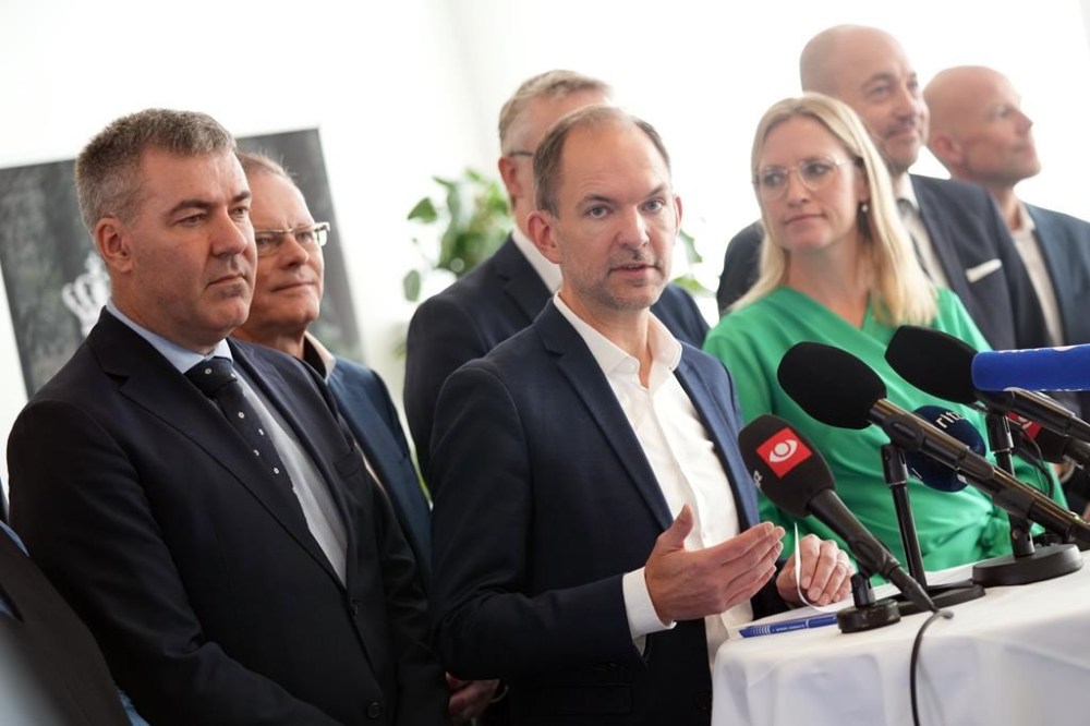 Denmark's Minister for the Green Tripartite Jeppe Bruus, center, and members of the coalition present a political agreement on the so-called green tripartite deal at the ministry in Copenhagen, Denmark, Monday, Nov. 18, 2024. (Ida Marie Odgaard/Ritzau Scanpix via AP)