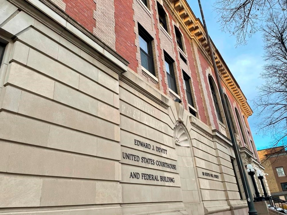 The Edward J. Devitt U.S. Courthouse and Federal building is seen, where two men on trial face human smuggling charges, Monday, Nov. 18, 2024, in Fergus Falls, Minn. (AP Photo/Michael Goldberg)