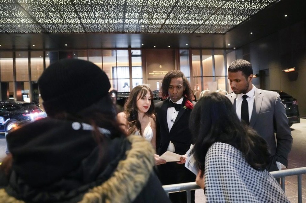 Former Giller Prize winner Ian Williams, centre, speaks to protesters as they demonstrate before the Giller Prize award ceremony in Toronto, Monday, Nov. 18, 2024. THE CANADIAN PRESS/Chris Young