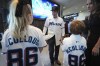 Miami Marlins baseball manager Clayton McCullough, center, talks with his wife Jill, right, and two of their three children following a news conference to present him Monday, Nov. 18, 2024, in Miami. (AP Photo/Rebecca Blackwell)
