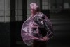 A woman wears a plastic poncho as rain falls in Vancouver, on Monday, September 25, 2023. Scientific terms to describe weather phenomena, such as atmospheric rivers and bomb cyclones, have become more commonplace in recent years. THE CANADIAN PRESS/Darryl Dyck
