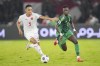 Indonesia's Rizky Ridho Ramadhani, 5, battles for the ball against Saudi Arabia's Marwan Al Sahafi during their 2026 World Cup Asian 3rd round qualifier soccer match at Gelora Bung Karno Main Stadium in Jakarta, Indonesia, Tuesday, Nov. 19, 2024. (AP Photo/Tatan Syuflana)