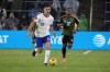 United States' Christian Pulisic (10) brings the ball down the pitch as Jamaica's Tayvon Gray (12) gives chase during the second half in a CONCACAF Nations League quarterfinal second leg soccer match Monday, Nov. 18, 2024, in St. Louis. (AP Photo/Jeff Roberson)