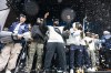 Toronto Argonauts players spray champagne during a Grey Cup championship rally in Toronto on Tuesday, Nov. 19, 2024. The Argonauts defeated the Winnipeg Blue Bombers on Sunday to win the cup. THE CANADIAN PRESS/Arlyn McAdorey