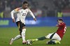 Germany's Benjamin Henrichs is tackled by Hungary's Szabolcs Schon during the Nations League soccer match between Hungary and Germany at the Puskas Arena stadium in Budapest, Tuesday, Nov. 18, 2024. (AP Photo/Denes Erdos)