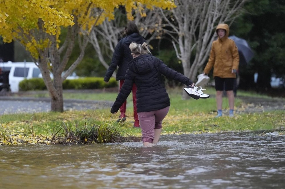 Storm dumps record rain and heavy snow on Northern California. Many in