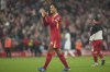 Liverpool's Virgil van Dijk celebrates after his team defeated Aston Villa 2-0 at the end of a English Premier League soccer match at the Anfield stadium in Liverpool, Saturday, Nov. 9, 2024. (AP Photo/Jon Super)