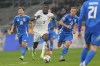 France's Marcus Thuram, centre, challenges for the ball with Italy's Nicolo Barella, left, and Davide Frattesi during the Nations League soccer match between Italy and France, at the San Siro stadium in Milan, Italy, Sunday, Nov. 17, 2024. (AP Photo/Luca Bruno)