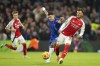 Chelsea's Enzo Fernandez vies for the ball with Arsenal's Ben White, right, during the English Premier League soccer match between Chelsea and Arsenal at Stamford Bridge stadium in London, Sunday, Nov. 10, 2021. (AP Photo/Kirsty Wigglesworth)
