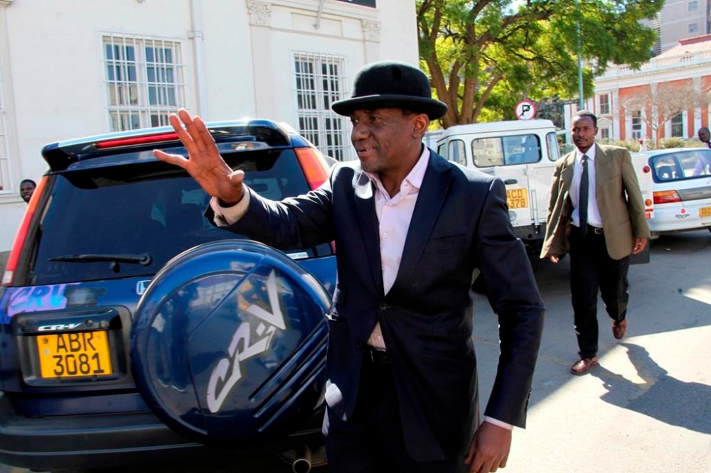 FILE - Then-Zimbabwe's minister of state in the Prime Minister's office Jameson Timba, arrives at the High Court in Harare, Sunday, June, 26, 2011. (AP Photo/Tsvangirayi Mukwazhi, File)