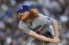 FILE - Los Angeles Dodgers starting pitcher Dustin May works against a San Diego Padres batter during the sixth inning of a baseball game Saturday, May 6, 2023, in San Diego. (AP Photo/Gregory Bull, File)