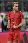 Bayern's Harry Kane celebrates after scoring the opening goal with the penalty kick during the Bundesliga soccer match between Bayern Munich and Augsburg at the Allianz Arena in Munich, Germany, Friday, Nov. 22, 2024. (AP Photo/Matthias Schrader)
