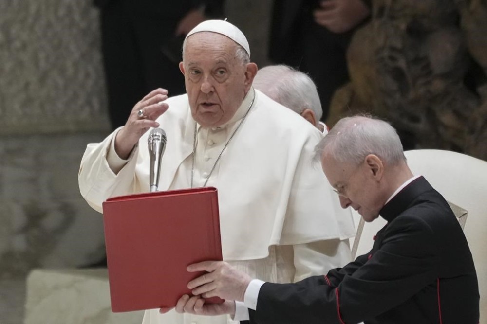 Pope Francis delivers his blessing during an audience with fishermen and members of the CEI, Italians Bishops Conference, in the Pope Paul VI hall at the Vatican, Saturday, Nov. 23, 2024. (AP Photo/Andrew Medichini)