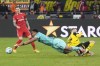 Freiburg's goalkeeper Noah Atubolu saves by Dortmund's Maximilian Beier during the German Bundesliga soccer match between Borussia Dortmund and SC Freiburg at the Signal-Iduna Park in Dortmund, Germany, Saturday, Nov. 23, 2024. (AP Photo/Martin Meissner)