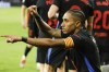 Barcelona's Raphinha celebrates scoring his side's opening goal during the Spanish La Liga soccer match between Celta Vigo and Barcelona at the Balaidos stadium in Vigo, Spain, Saturday, Nov. 23, 2024. (AP Photo/Lalo R. Villar)