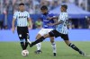 Agustin Almendra, right, of Argentina's Racing Club and Joao Marcelo of Brazil's Cruzeiro battle for the ball during the Copa Sudamericana final soccer match in Asuncion, Paraguay, Saturday, Nov. 23, 2024. (AP Photo/Jorge Saenz)