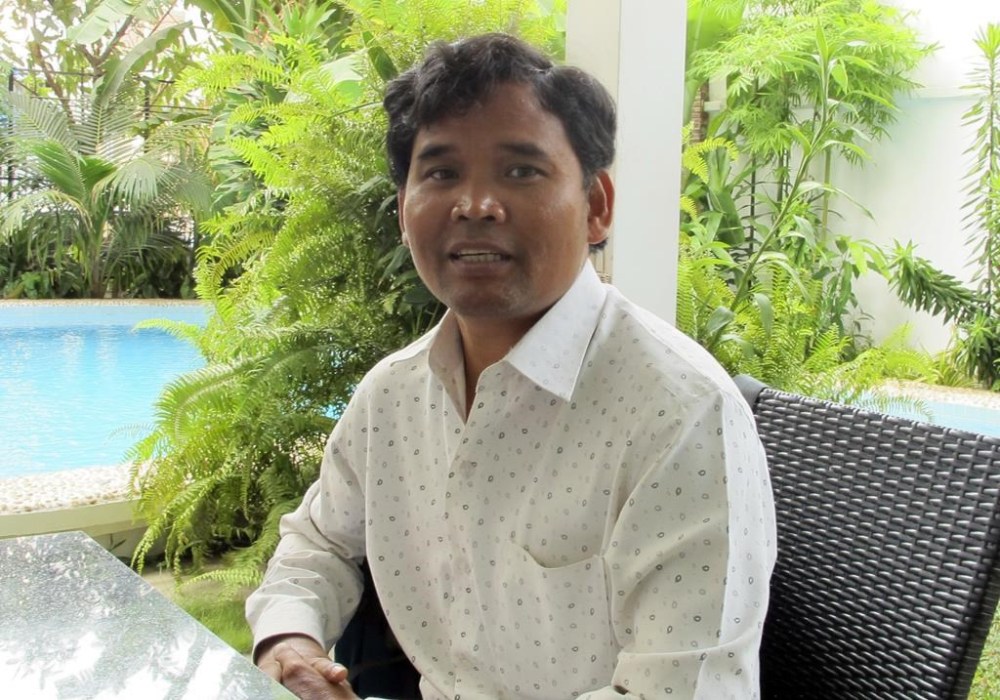 FILE - In this Feb. 3, 2016 photo, Cambodian environmentalist Ouch Leng speaks during an interview with the Associated Press in the Cambodian capital of Phnom Penh. (AP Photo/Elaine Kurtenbach, File)