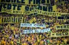 FILE - A banner against Borussia Dortmund's sponsorship deal with German arms manufacturer Rheinmetall is displayed during the German Bundesliga soccer match between Borussia Dortmund and Eintracht Frankfurt at the Signal Iduna Park stadium, in Dortmund, Germany, on Aug. 24, 2024. (Bernd Thissen/dpa via AP, File)