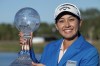 Jeeno Thitikul poses on the 18th green with the LPGA CME Group Tour Championship golf tournament trophy Sunday, Nov. 24, 2024, in Naples, Fla. (AP Photo/Chris Tilley)