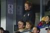Ipswich Town fan Ed Sheeran, top, cheers for his team during the English Premier League soccer match between Ipswich Town and Manchester United at Portman Road stadium in Ipswich, England, Sunday, Nov. 24, 2024. (AP Photo/Dave Shopland)