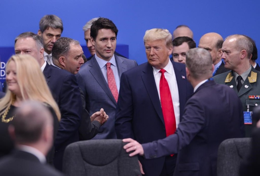Prime Minister Justin Trudeau and U.S. President Donald Trump arrive to take part in a plenary session at the NATO Summit in Watford, Hertfordshire, England, Wednesday, Dec. 4, 2019. THE CANADIAN PRESS/Sean Kilpatrick