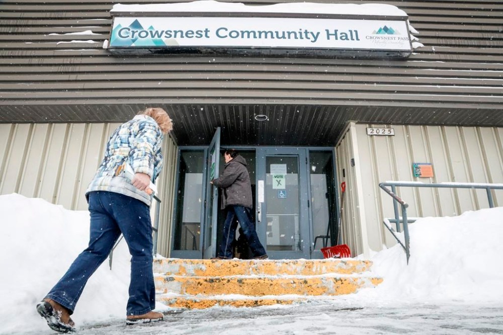 Residents enter a polling station to cast their votes in a plebiscite on whether to support a new coal mine in Crowsnest Pass, Alta., Monday, Nov. 25, 2024.THE CANADIAN PRESS/Jeff McIntosh