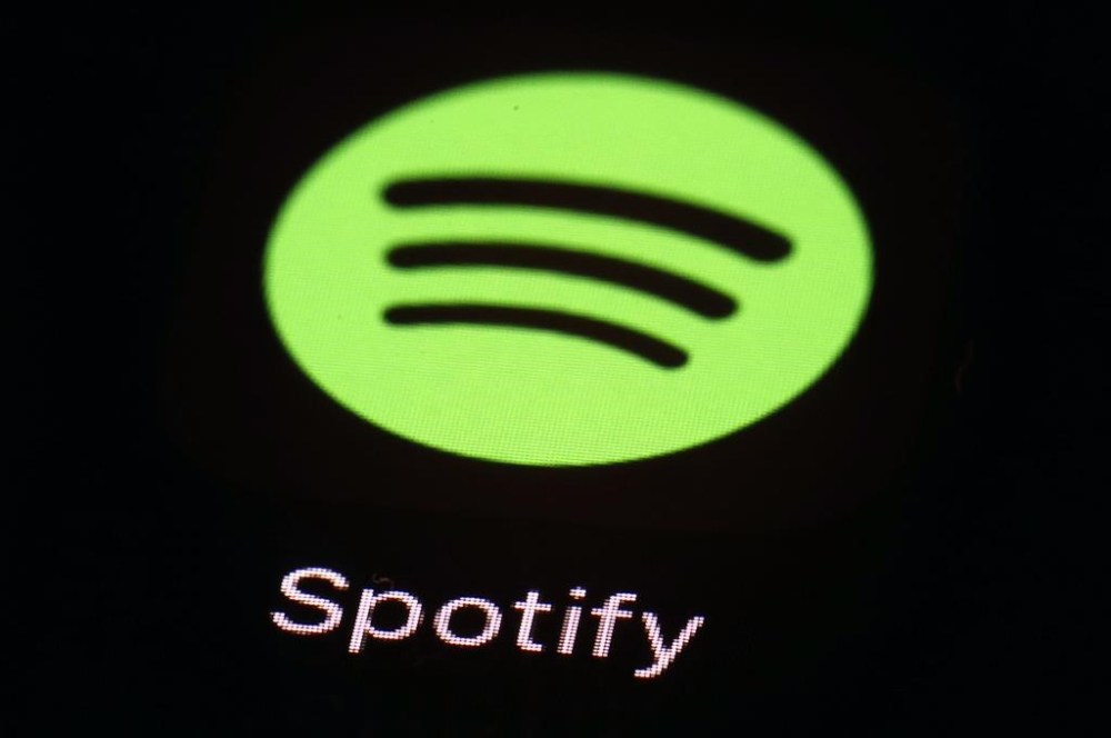 FILE- This March 20, 2018 file photo shows the Spotify app on an iPad in Baltimore. (AP Photo/Patrick Semansky, File)