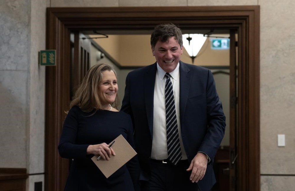 Deputy Prime Minister and Minister of Finance Chrystia Freeland walks with Minister of Public Safety, Democratic Institutions and Intergovernmental Affairs Dominic LeBlanc as they make their way to speak with reporters following cabinet meeting on Parliament Hill, in Ottawa, Tuesday, Nov. 26, 2024. THE CANADIAN PRESS/Adrian Wyld