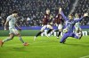 Atletico's Julian Alvarez, left, scores his side's second goal against Sparta's goalkeeper Peter Vindahl during the UEFA Champions League opening phase soccer match between Sparta Prague and Athletico Madrid in Prague, Czech Republic, Tuesday, Nov. 26, 2024. (Roman Vondrous//CTK via AP)