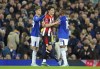 Brentford's Christian Norgaard reacts after being shown a red card for serious foul play during the English Premier League soccer match between Everton and Brentford at Goodison Park in Liverpool, England, Saturday, Nov. 23, 2024. (Peter Byrne/PA via AP)