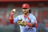 FILE - St. Louis Cardinals shortstop Brandon Crawford works a rundown of Kansas City Royals' Bobby Witt Jr. during the fifth inning of a baseball game, Aug. 10, 2024, in Kansas City, Mo. (AP Photo/Reed Hoffmann, File)