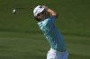 Joaquin Niemann of Chile plays a second shot on the 7th hole during the second round of World Tour Golf Championship in Dubai, United Arab Emirates, Saturday, Nov. 16, 2024. (AP Photo/Altaf Qadri)