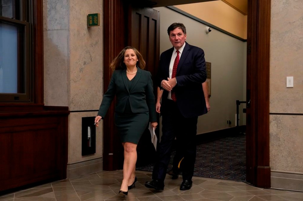 Finance Minister Chrystia Freeland Minister of Public Safety Dominic LeBlanc
make their way to speak with reporters, Wednesday, Nov. 27, 2024. THE CANADIAN PRESS/Adrian Wyld