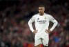 Real Madrid's Kylian Mbappe stands on the pitch during the Champions League opening phase soccer match between Liverpool and Real Madrid at Anfield Stadium, Liverpool, England, Wednesday, Nov. 27, 2024. (Peter Byrne/PA via AP)