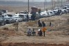 Lebanese families sit in traffic as they return to Lebanon through the Jousieh border crossing, in Qusair, Syria, Thursday, Nov. 28, 2024, following a ceasefire between Israel and Hezbollah that went into effect on Wednesday. (AP Photo/Omar Sanadiki)