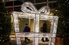 People make their way past a display of Christmas lights in the shape of a present during the holiday season in Ottawa on Tuesday, Dec. 19, 2023. THE CANADIAN PRESS/Sean Kilpatrick