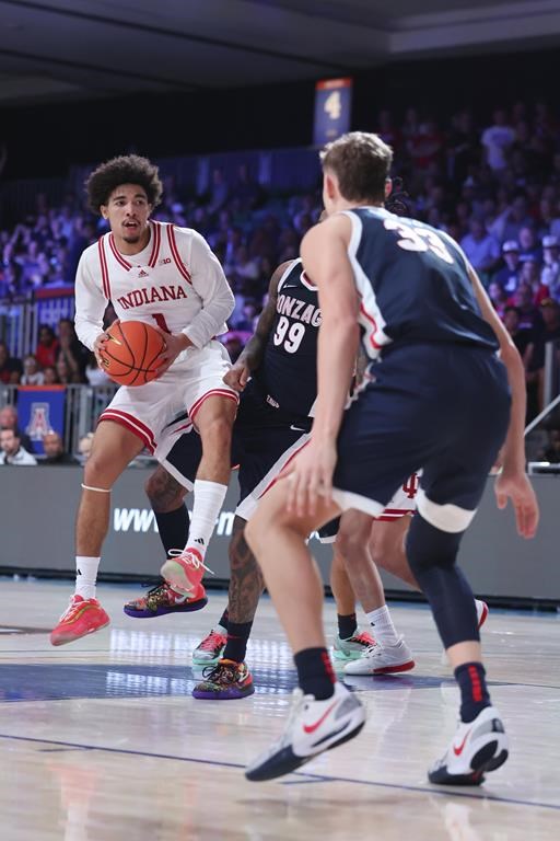 In this photo provided by Bahamas Visual Services, Indiana's Myles Rice controls the bal against Gonzaga during an NCAA college basketball game Thursday, Nov. 28, 2024, in Paradise Island, Bahamas. (Tim Aylen/Bahamas Visual Services via AP)