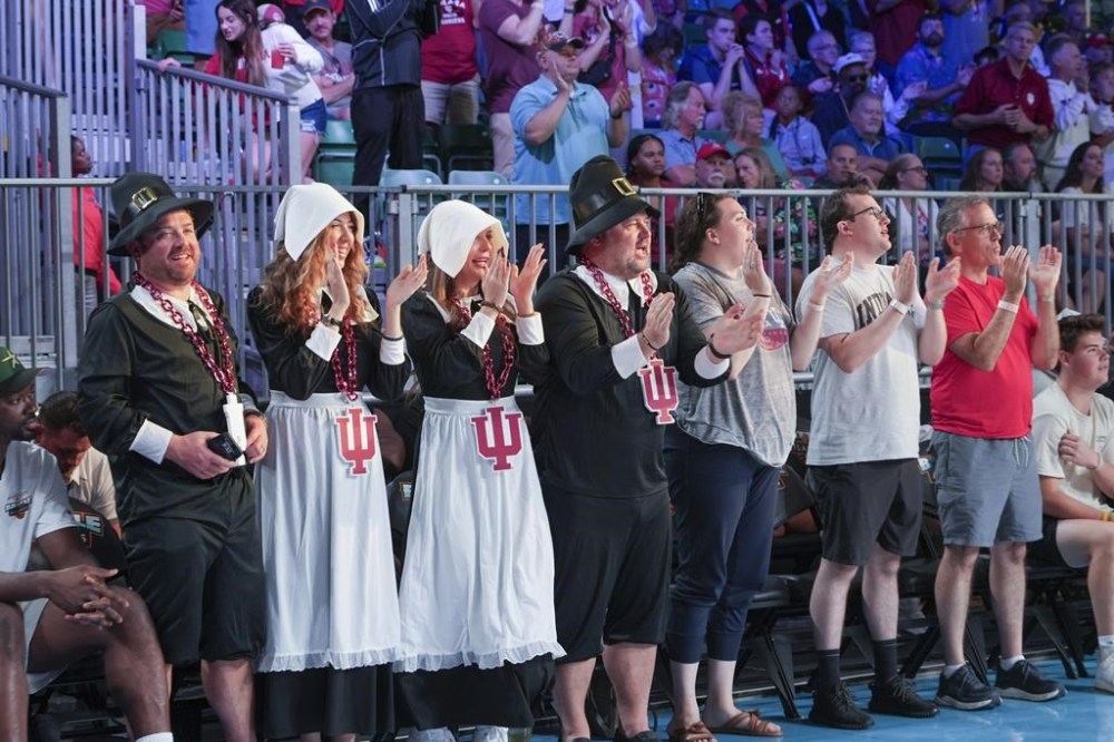 In this photo provided by Bahamas Visual Services, people react during an NCAA college basketball game between Indiana and Gonzaga, Thursday, Nov. 28, 2024, in Paradise Island, Bahamas. (Tim Aylen/Bahamas Visual Services via AP)