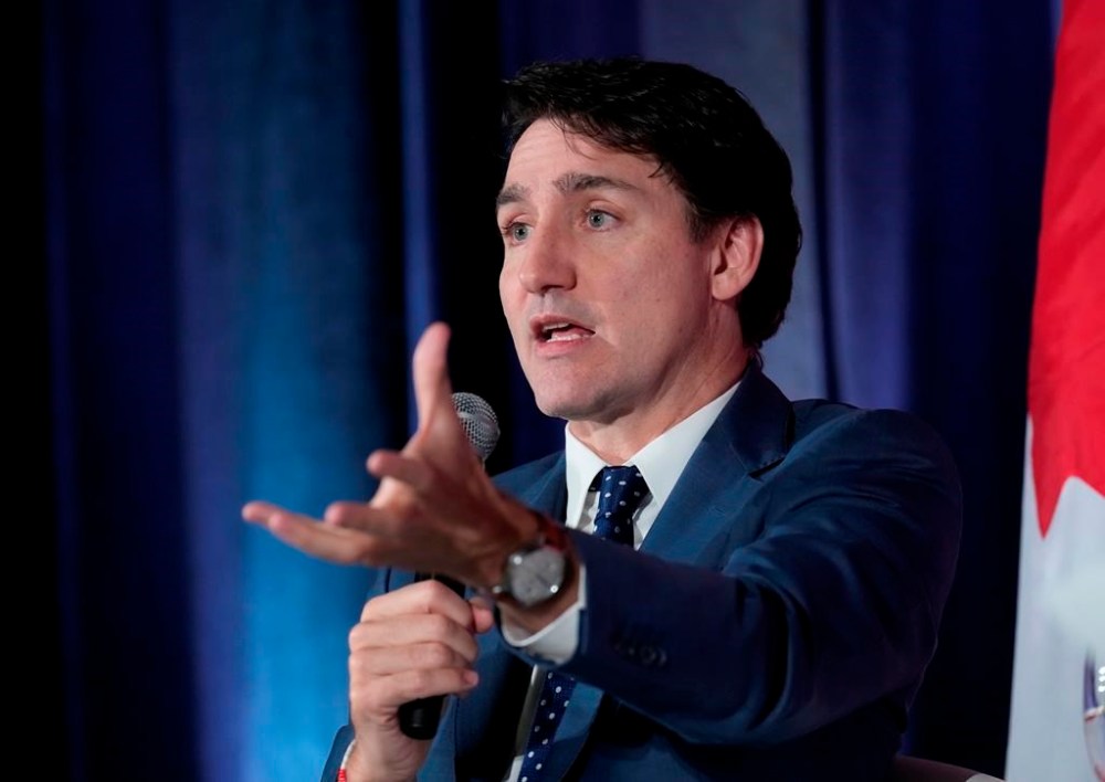 Prime Minister Justin Trudeau participates in an arm chair discussion at the Sustainable Finance conference in Ottawa on Thursday Nov. 28, 2024. THE CANADIAN PRESS/Adrian Wyld