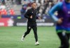 Toronto FC head coach John Herdman jogs off the field during halftime of the Canadian Championship final soccer match against the Vancouver Whitecaps in Vancouver on Wednesday, Sept. 25, 2024. THE CANADIAN PRESS/Darryl Dyck