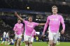 Southampton's Flynn Downes, right, celebrates scoring during the Englidh Premier League soccer match at the American Express Stadium, Brighton and Hove, England, Friday Nov. 29, 2024. (Gareth Fuller/PA via AP)