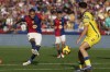 Barcelona's Raphinha kicks a ball challenged by Las Palmas' Mika Marmol during a Spanish La Liga soccer match at the Lluis Companys Olympic Stadium in Barcelona, Spain, Saturday Nov. 30, 2024. (AP Photo/Joan Monfort)