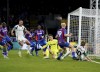 Newcastle United's Anthony Gordon (right) crosses the ball into the box resulting in an own goal by Crystal Palace's Marc Guehi during the English Premier League soccer match between Crystal Palace and Newcastle United at Selhurst Park, London, Saturday Nov. 30, 2024. (Ben Whitley/PA via AP)